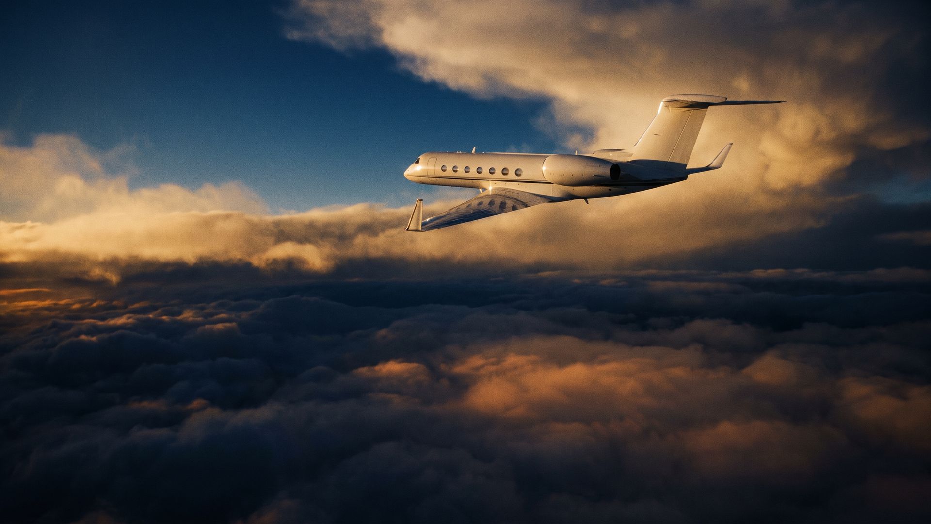 A business jet climbing above the clouds at sunrise
